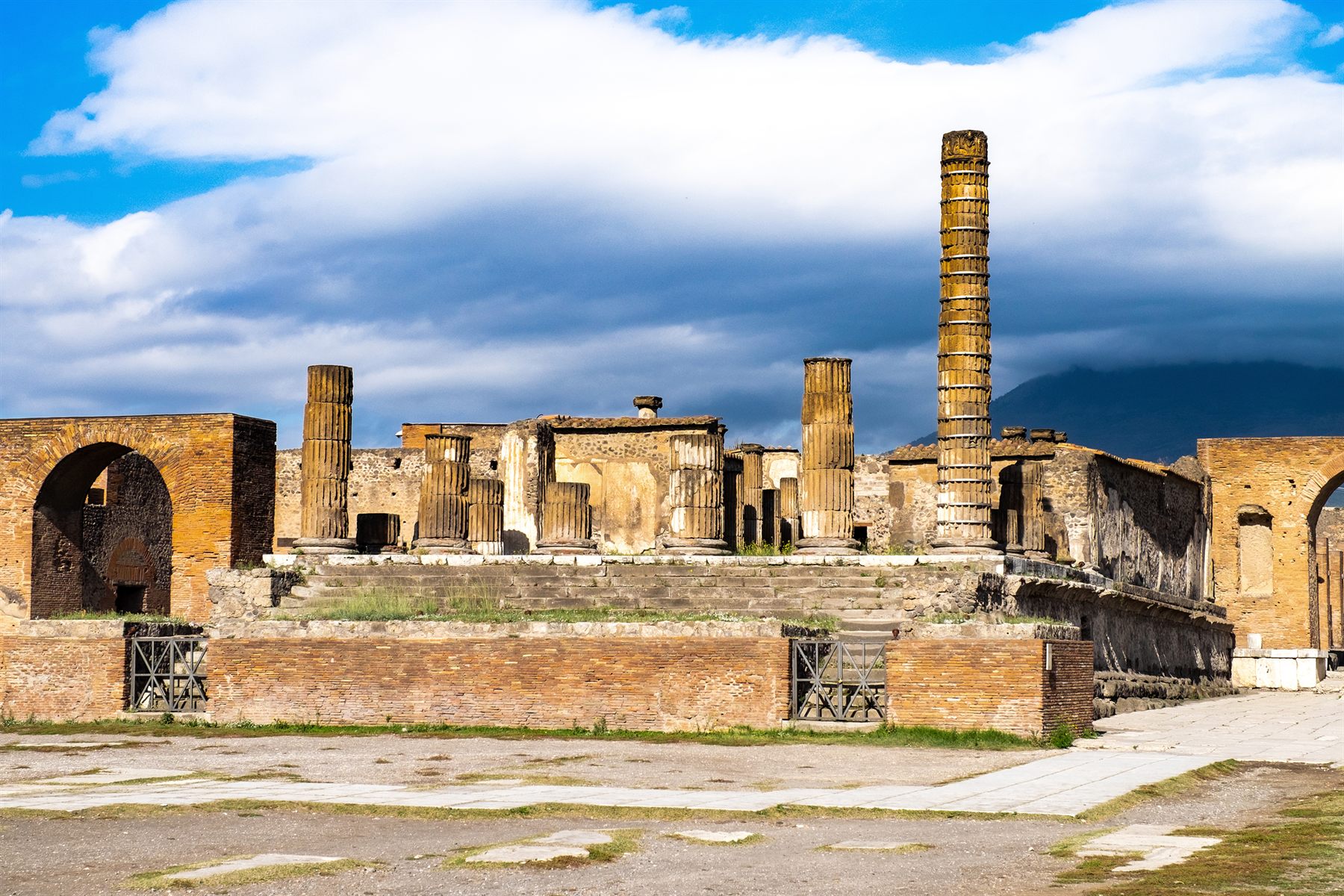 Columns and brick walls of the Roman forum ruins at Pompeii, near Naples