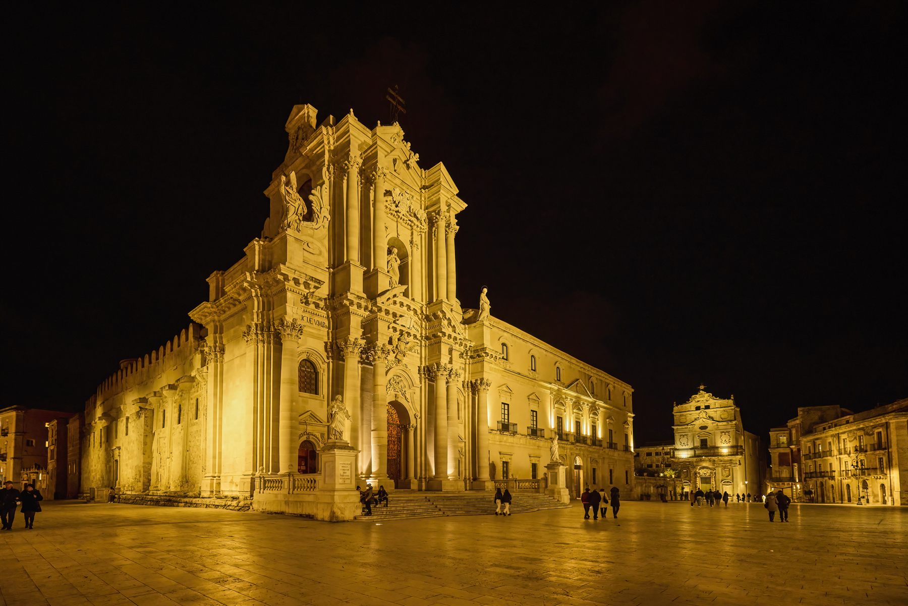 The floodlit baroque cathedral and square on Ortigia, Siracusa, Sicily, at night